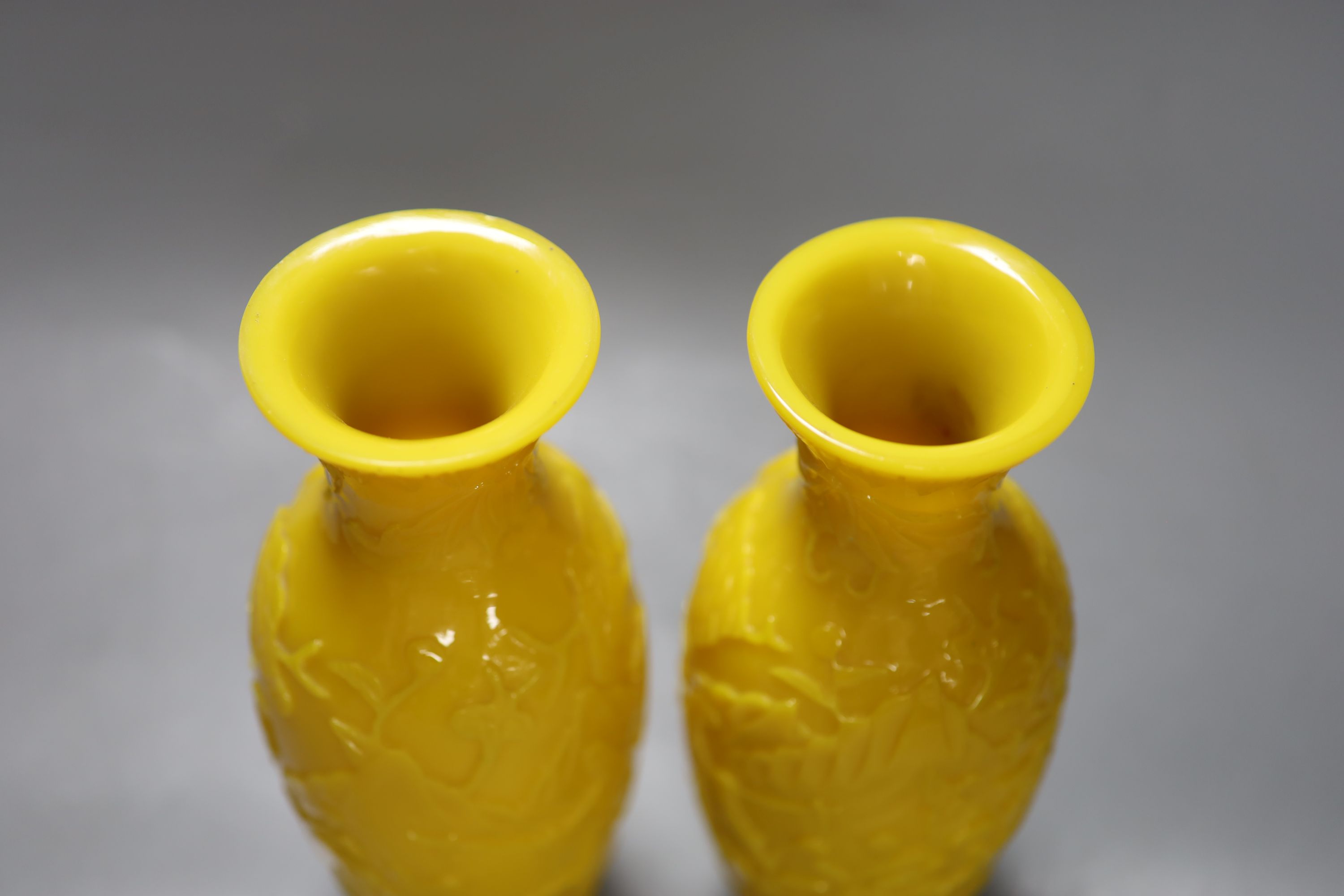 A pair of Chinese Beijing yellow glass vases, c.1900, height 21.5cm